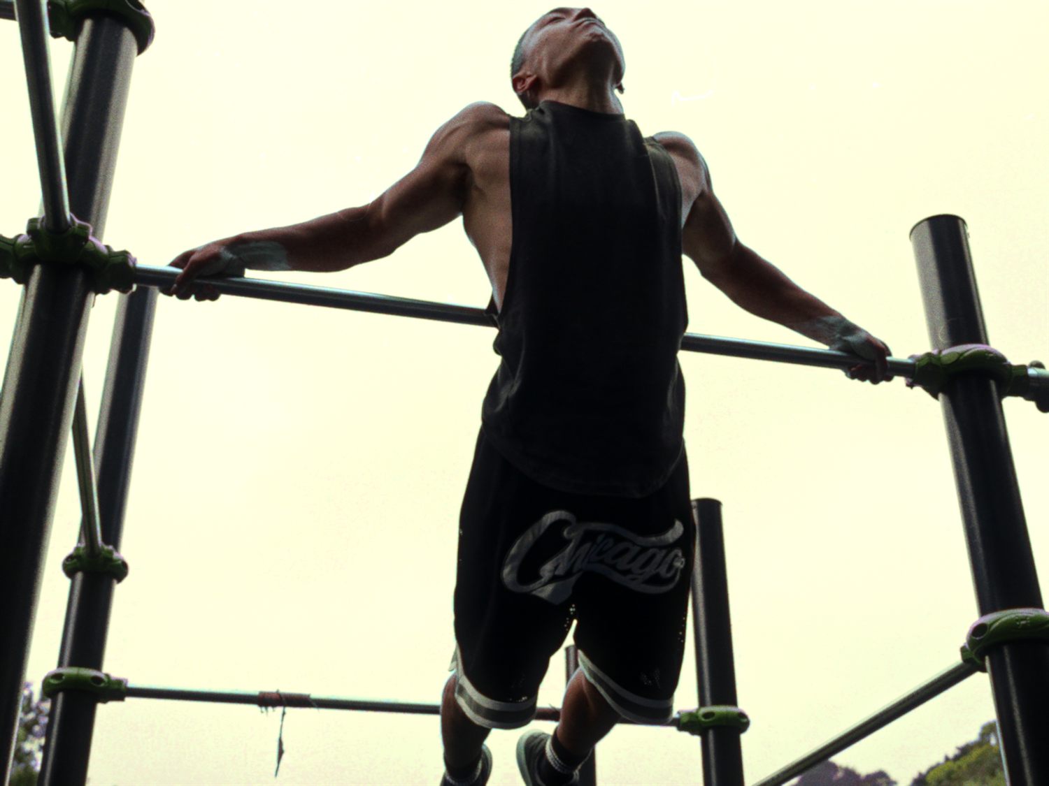 Felix Ng training on a calisthenics rig
